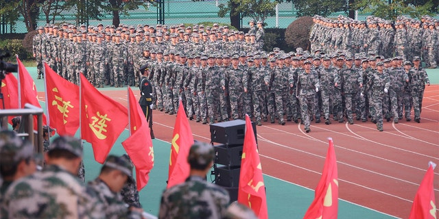 New students take part in a military training at Southeast University on October 22, 2021 in Nanjing, Jiangsu Province, China.