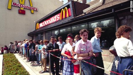 Russians wait in line outside a McDonald's fast food restaurant in Moscow in 1990. 