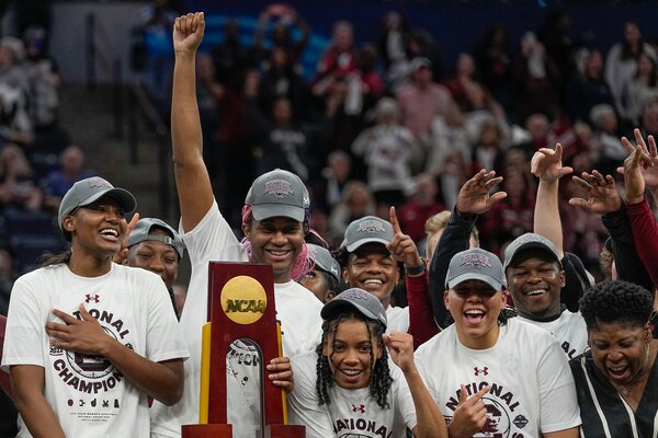 South Carolina players celebrating with the trophy.