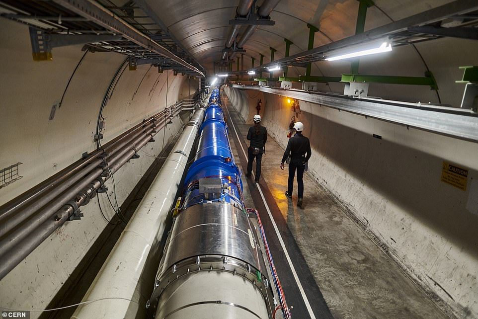 Future experiments at CERN will attempt to unravel mysteries such as dark matter and dark energy.  Pictured above, a series of dipole magnets inside a tunnel at CERN's Large Hadron Collider