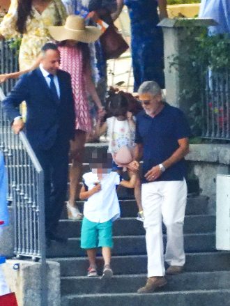 Cernobbio, Italy - *EXCLUSIVE* - Actor George Clooney and his wife Amal are enjoying their family vacations in County Como.  The 61-year-old The Ocean's Eleven actor, 61, looked casual in his blue shirt during a boat trip with Amal rocked in her summer dress and hat, while enjoying vistas of her scenic surroundings during the family trip.  Pictured: George Clooney - Amal Clooney USA Backlines Must Read July 13, 2022: Team Cobra / Backgridosa: +1 310798 9111 / usasales@backgrid.comUK: +44208344 2007 / uksales@backgrid.com* UK Customers - Images containing children, please select a face before posting *