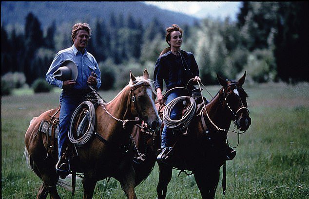 Robert Redford and Kristen Scott Thomas are photographed during a scene in the movie adaptation of The Horse Whisperer