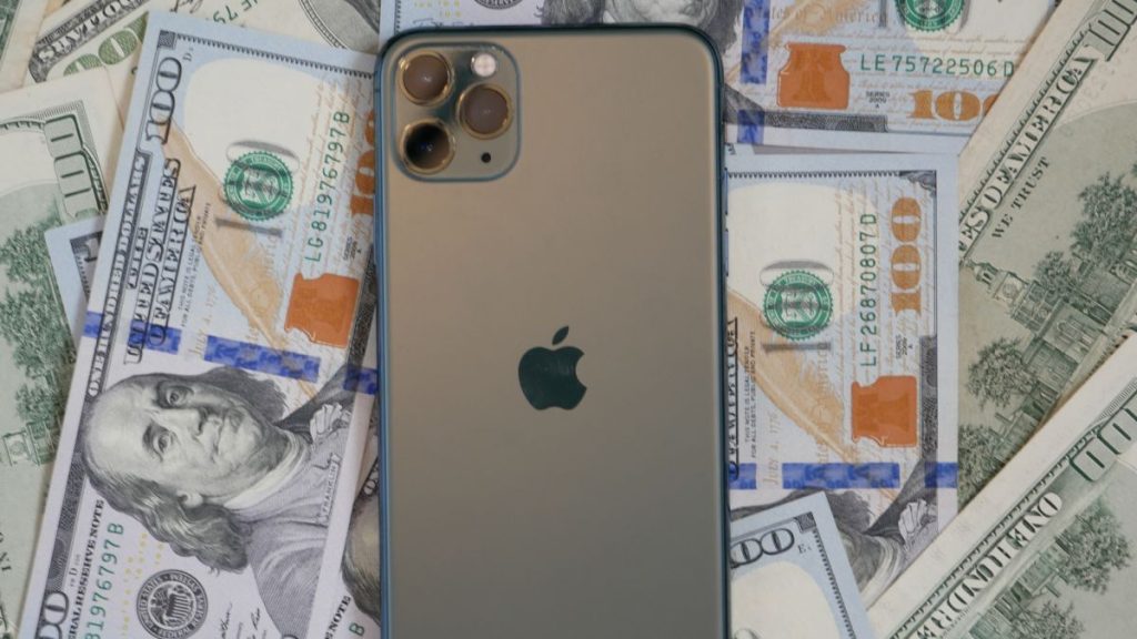 iPhone on a pile of money